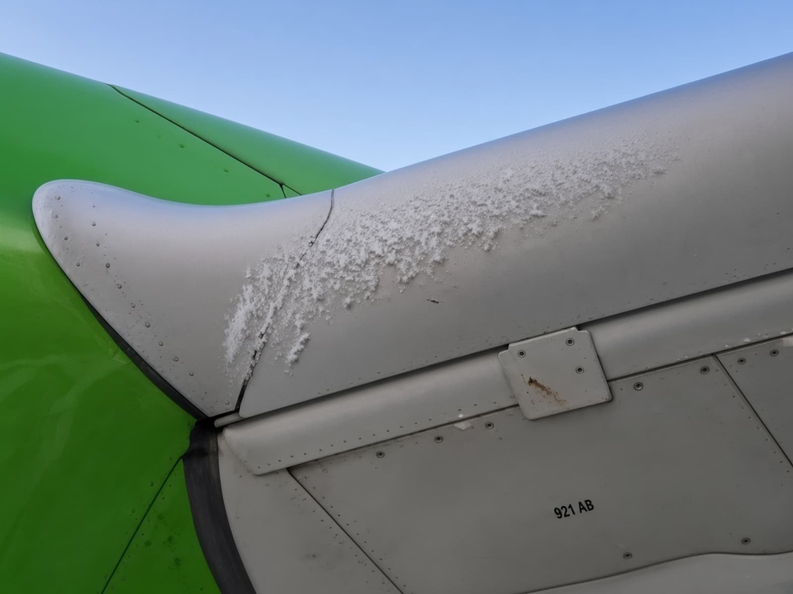 Frost on the left wing's leading edge, near where it joins the fuselage.